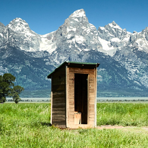 Wooden outhouse and barn in Mormon Row, Grand Teton National Park, USA.