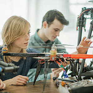 Students building a drone.