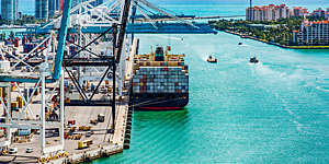 A container ship at the Port of Miami-Dade loaded and ready to set sail on an international journey.